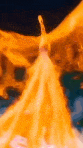 a painting of a woman in a yellow dress with wings is being displayed .