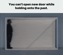 a man is standing in a box with the words " you can 't open new door while holding onto the past " above him