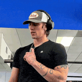 a man wearing headphones and a hat that says brian on it