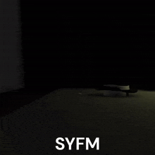 a dark room with the word syfm on the bottom left