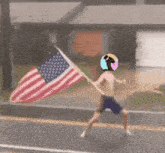 a man with a helmet on his head is holding an american flag