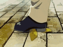 a close up of a person 's foot on a tile floor