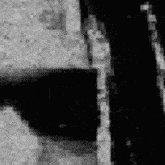 a black and white photo of a person wearing sunglasses