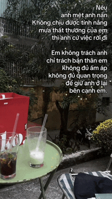 a glass of milk sits on a green table
