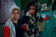 a boy and a woman standing next to each other