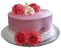 a pink cake with red roses and gold leaves