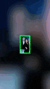a picture of a man and a woman with a green frame