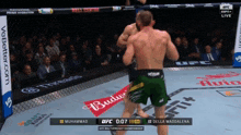 muhammad and della maddalena fighting in a ufc match