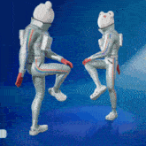 a couple of people in space suits are dancing