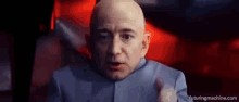 a bald man is dressed as dr. evil from the movie dr. evil .