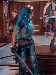 a woman with blue hair is holding a sword while standing next to another woman .