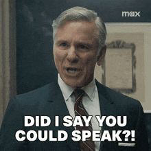 a man in a suit and tie is saying did i say you could speak