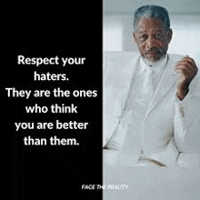 a man in a white suit and tie is sitting on a couch with a quote .
