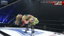 two women are wrestling in a ring and the words stardom are on the bottom right