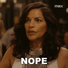 a woman in a white dress says nope