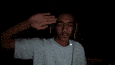 a man wearing headphones and a nike shirt