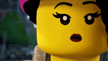 a close up of a lego girl 's face with a surprised expression