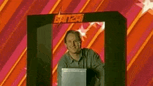 a man stands in front of a banzai sign