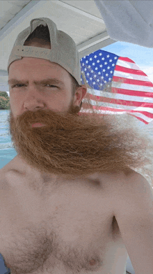 a shirtless man with a long beard wearing a hat that says ' abercrombie & fitch ' on it