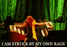 a woman is standing in front of a piano with the words i am struck by my own rage above her