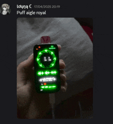 a person is holding a puff aigle royal device