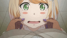a close up of a girl with green eyes