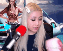a woman is sitting in front of a red microphone with a clipeo.com watermark in the corner