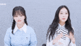 two girls are standing next to each other and the word signal is on the bottom