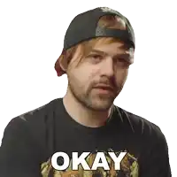 a man wearing a black shirt that says okay on it
