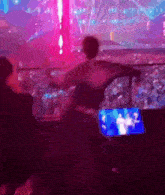 a blurry picture of a person in a stadium watching a concert