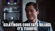 a man in a suit and tie is talking to another man in a room .