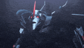 a robot with red eyes and a red arrow pointing up