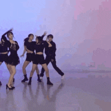 a group of people are dancing together in a room