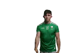 a man wearing a green shirt with the number 13 on the front