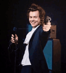 Harry Styles One Direction GIF - Harry Styles One Direction Gun GIFs