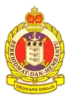 a purple and yellow emblem with the words " berkhidmat dan membantu "