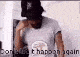 a man wearing a baseball cap and a t-shirt that says do n't let it happen again