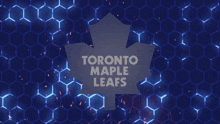 the toronto maple leafs logo is displayed on a blue background