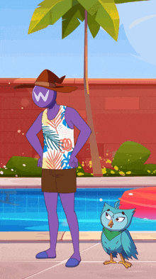 a man with a w on his shirt stands next to an owl by a pool