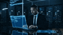 a man is looking at a computer screen with miguel angelz written on the bottom right