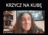 a woman with long hair is sitting in front of a computer screen with a caption that says `` krzycz na kube '' .