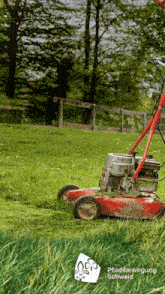 a person is mowing a lush green field with a pfadbewegung schweiz logo on the bottom