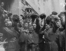 a black and white photo of a group of soldiers with pathe written in the corner