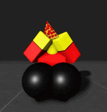 a red and yellow cube with a pizza on top