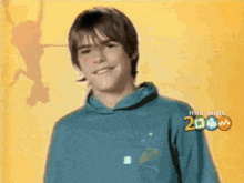 a young boy wearing a blue hoodie with the year 2008 on it