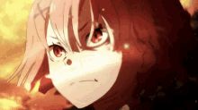 a close up of a girl with pink hair and red eyes making a funny face .