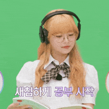 a girl wearing headphones and glasses is reading a book in korean