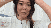a woman in a white shirt with today 's subs 232 on the bottom right