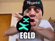 a man wearing a beanie that says blizzard x