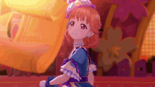 a girl wearing a blue dress and a hat is smiling